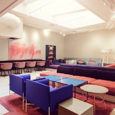 Loung area with light coming in from a ceiling window.